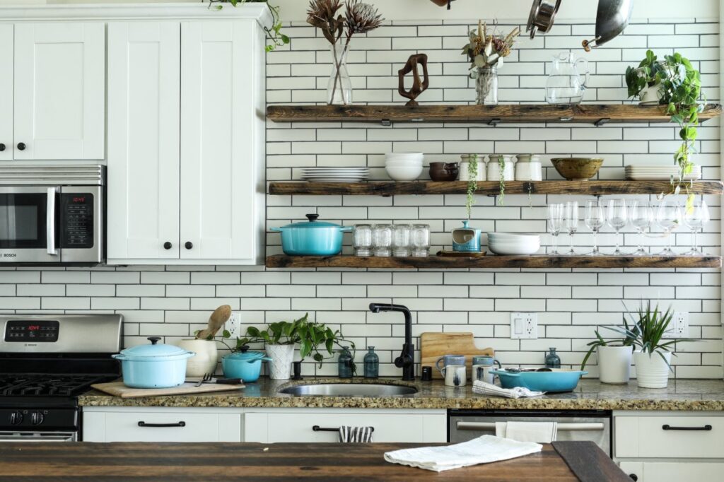 a kitchen with shelves and pots